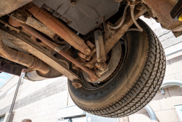 Underside inspection of the 1970 Chevrolet Corvette documenting its initial condition before restoration at Crown Customs