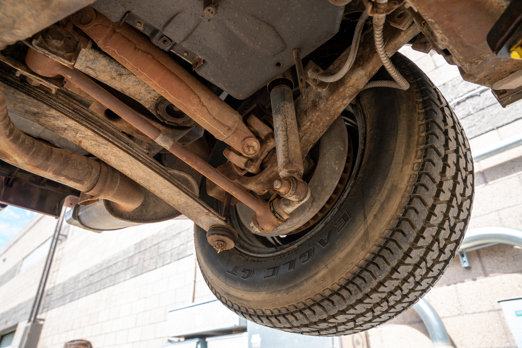 Underside inspection of the 1970 Chevrolet Corvette documenting its initial condition before restoration at Crown Customs