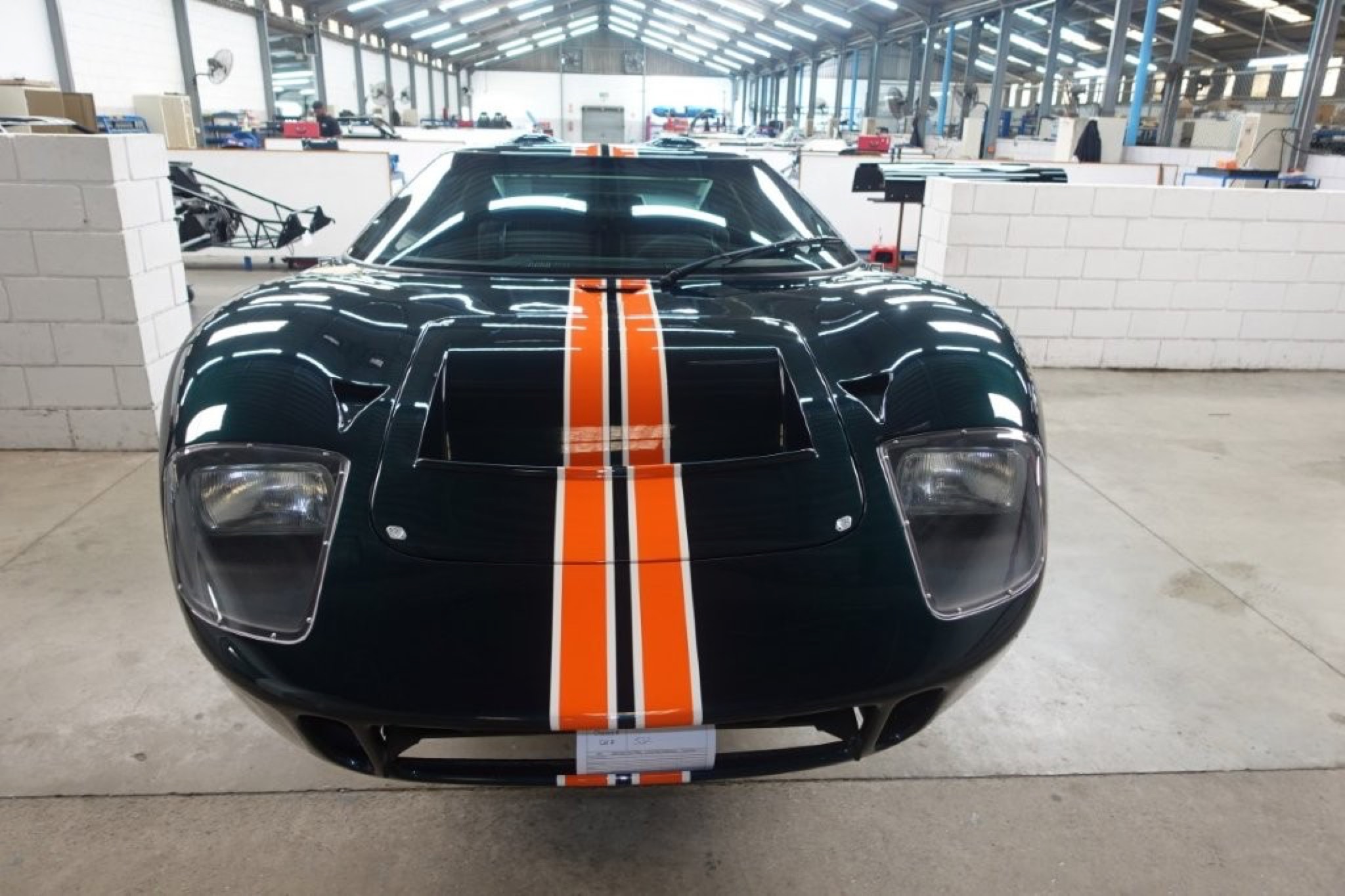 Superformance GT40 MKI, chassis P2534, in olive green with Gulf-orange and white stripes as delivered from the factory, before its Crown Customs powertrain install