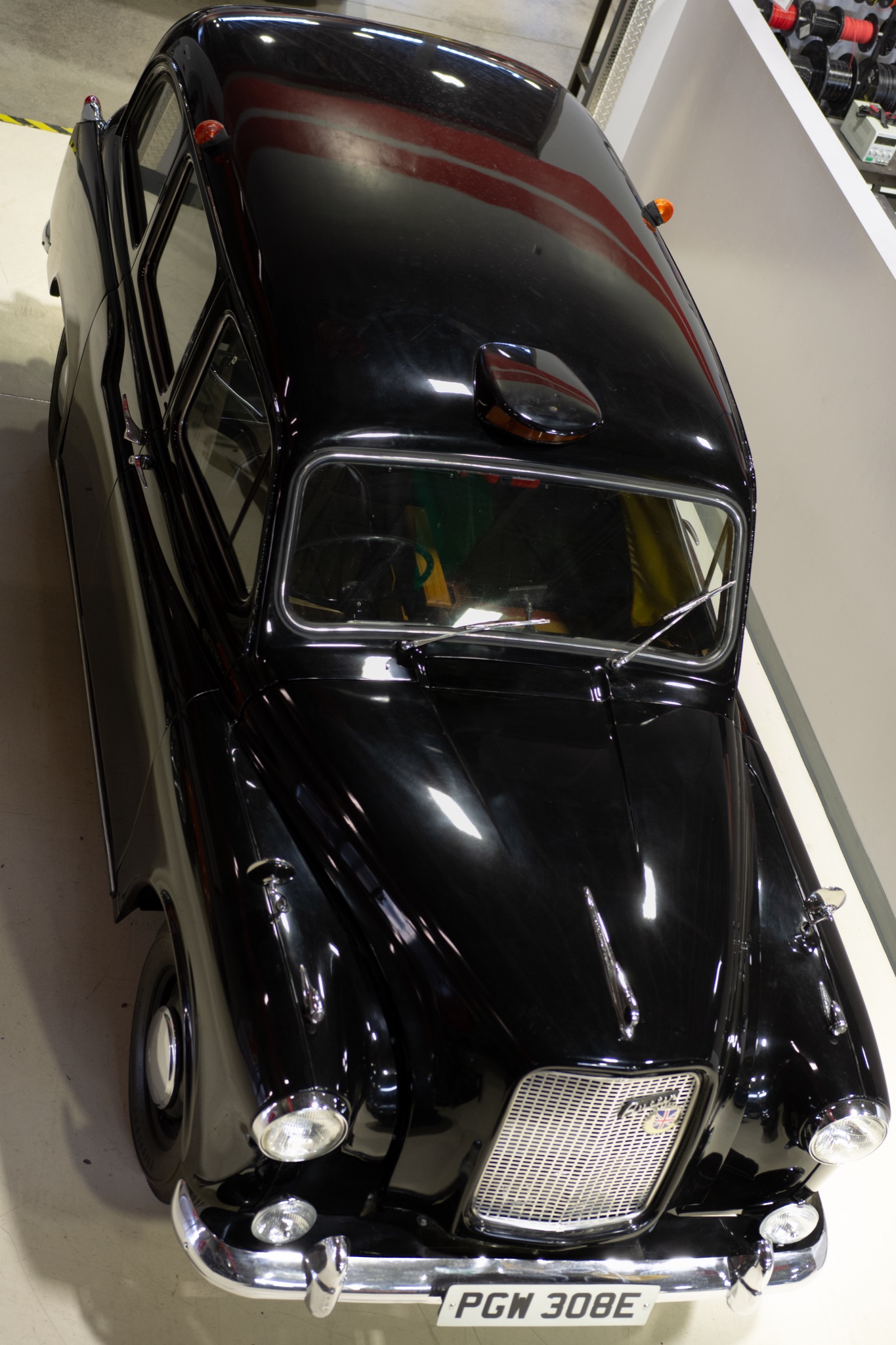 Front three-quarter view of the 1967 Austin FX4 London Taxi Cab showing its distinctive upright grille and cab shape