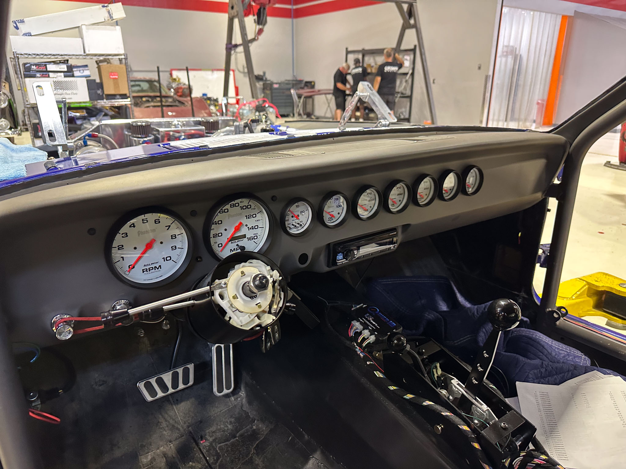 The 1965 Ford Mustang Fastback twin turbo custom build during engine and driveline work at Crown Customs