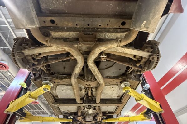 Engine removal underway on the 1970 Chevrolet Corvette frame-off restoration at Crown Customs