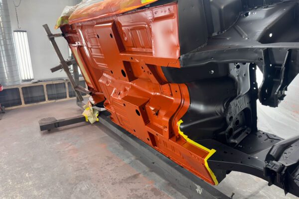 Body panel and paint work on a 1967 Ford Mustang convertible during restoration