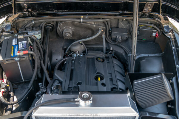 Engine bay of the 1967 Austin FX4 London taxi cab with its modern turbocharged Ford EcoBoost engine, aluminium radiator and intercooler fitted by Crown Customs