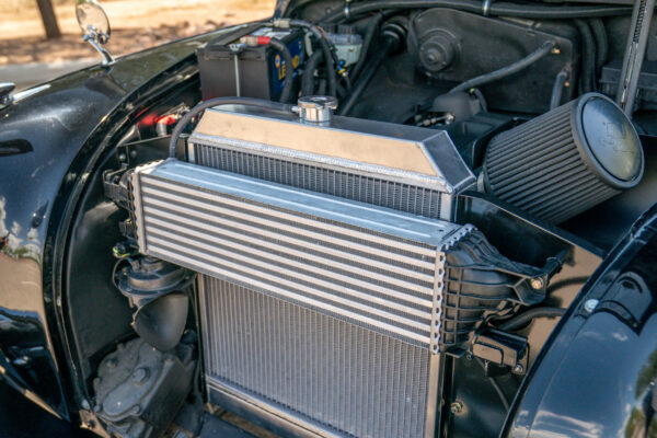 Front mounted intercooler and conical air filters packaged into the engine bay of the Austin FX4 London taxi cab
