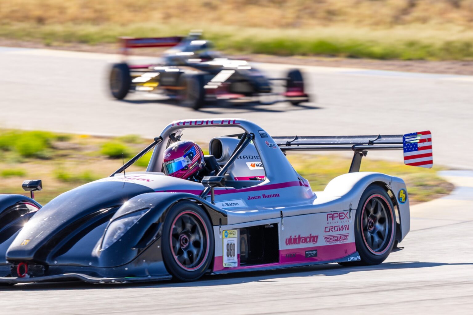 Two Radical prototypes running close together on track at INDE Motorsports Ranch in Willcox, Arizona