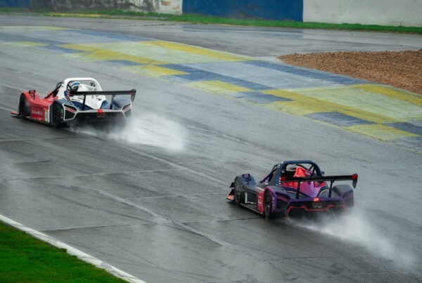 Crown Racing Radical race car navigating a rain-soaked Michelin Raceway Road Atlanta