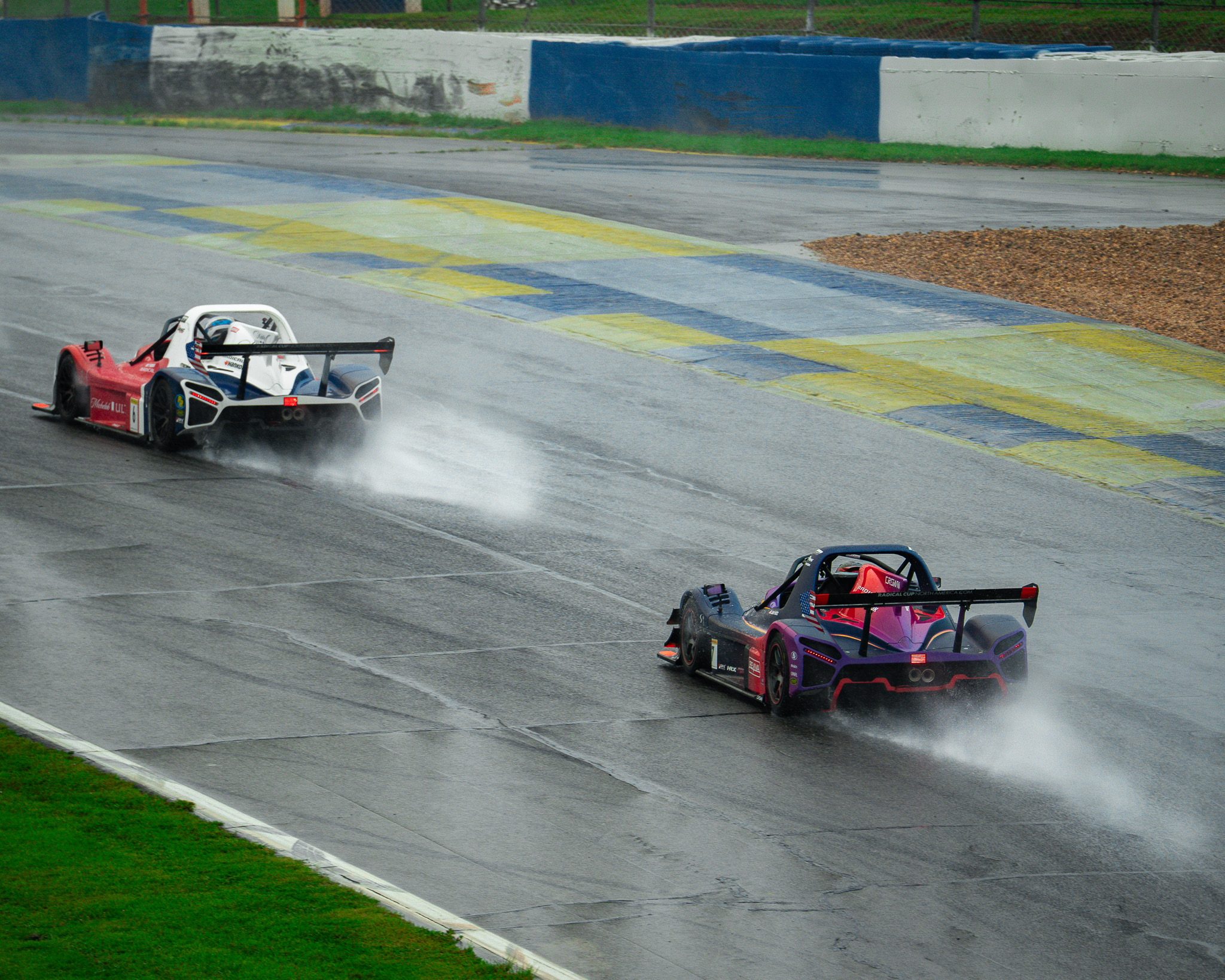Crown Racing Radical race car navigating a rain-soaked Michelin Raceway Road Atlanta