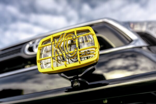 Close-up of the KC HiLiTES logo on a driving light, Toyota Tacoma Back to the Future tribute truck