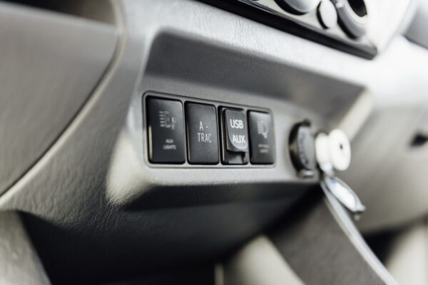 Interior dashboard controls with key fob on a 2016 Toyota Tacoma tribute truck