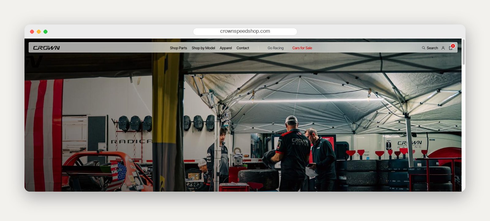 The Crown Speed Shop home page over a photograph of the Crown Racing paddock at a race weekend