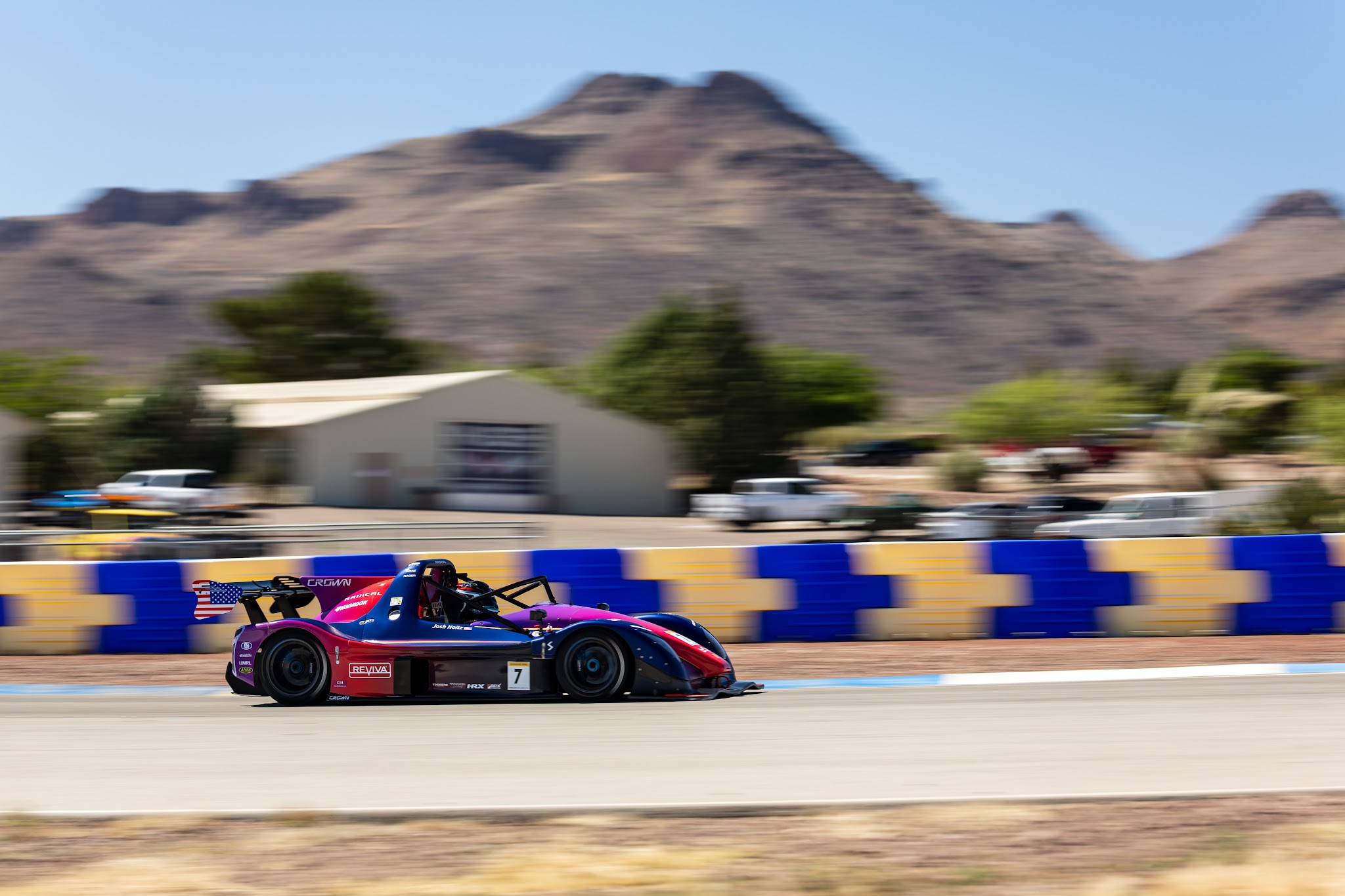 Josh Holtz's number 7 Radical prototype at speed at Inde Motorsports Ranch