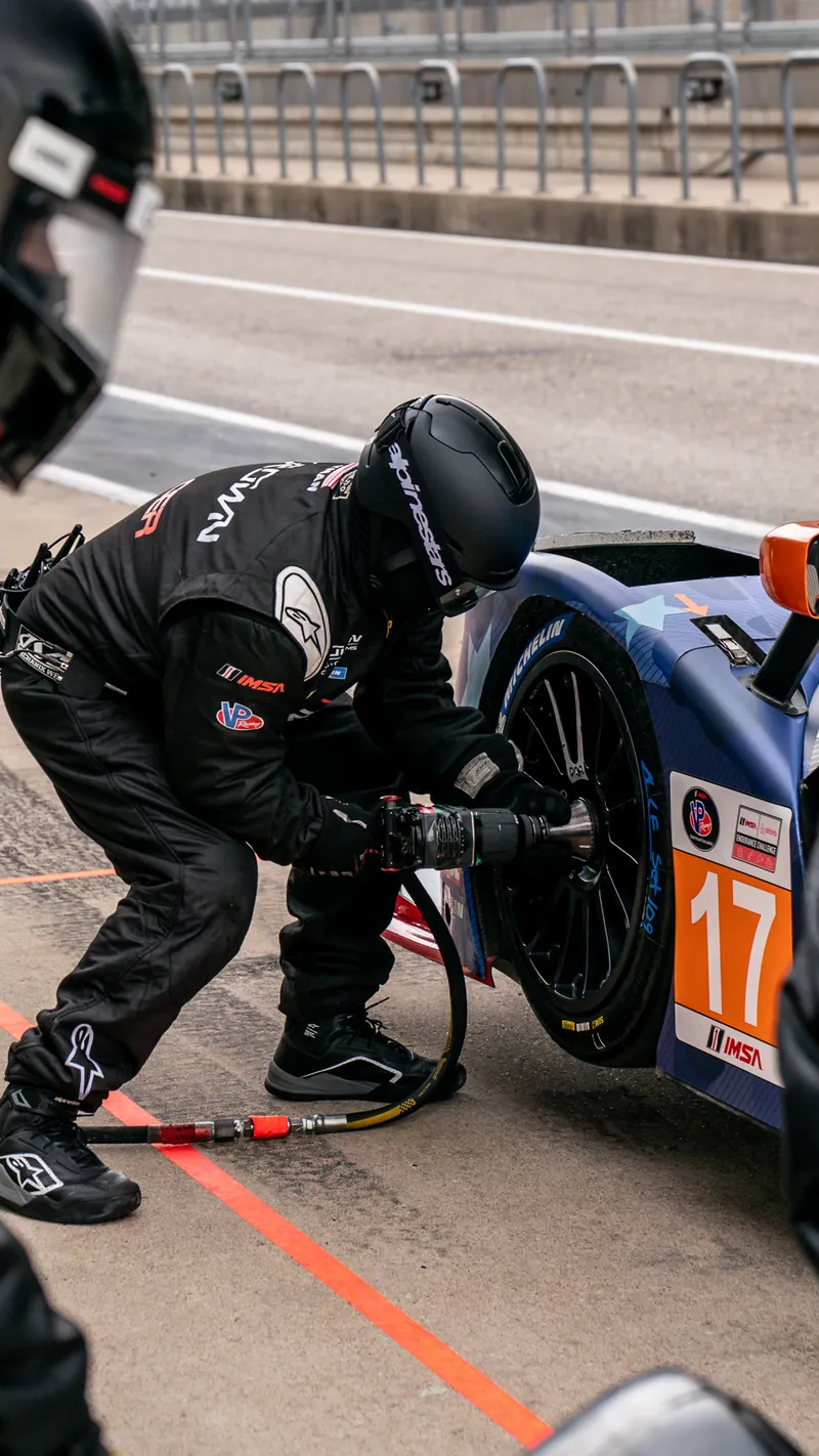 Crown Racing crew member changing a rear tire on the No. 17 Ligier JS P320 in the pit lane at Circuit of The Americas
