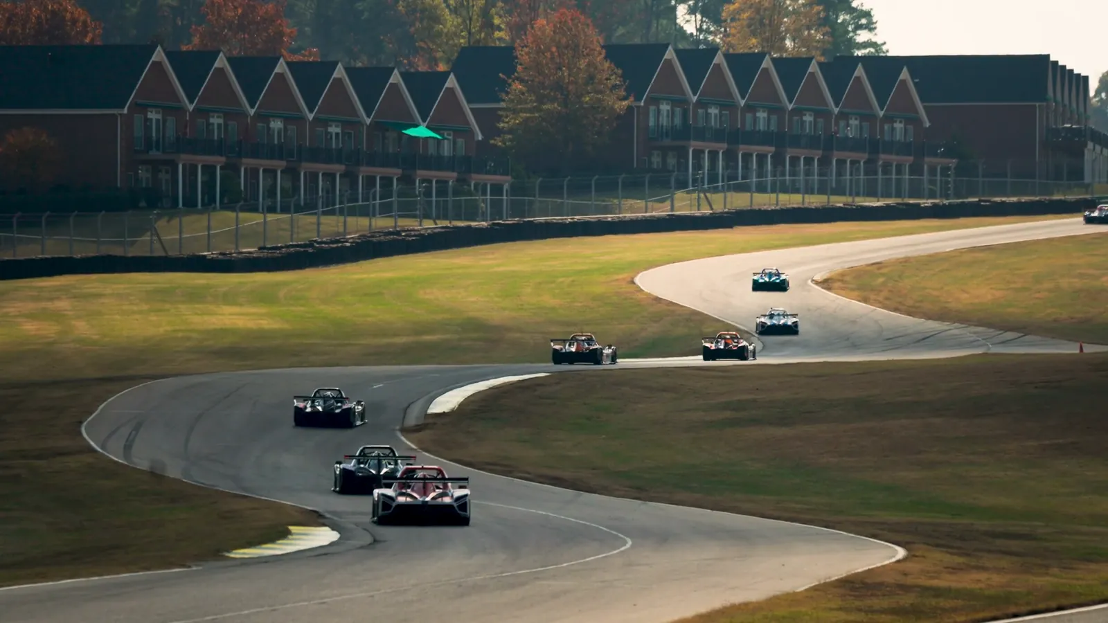 Radical prototypes streaming through the esses at VIRginia International Raceway in autumn light