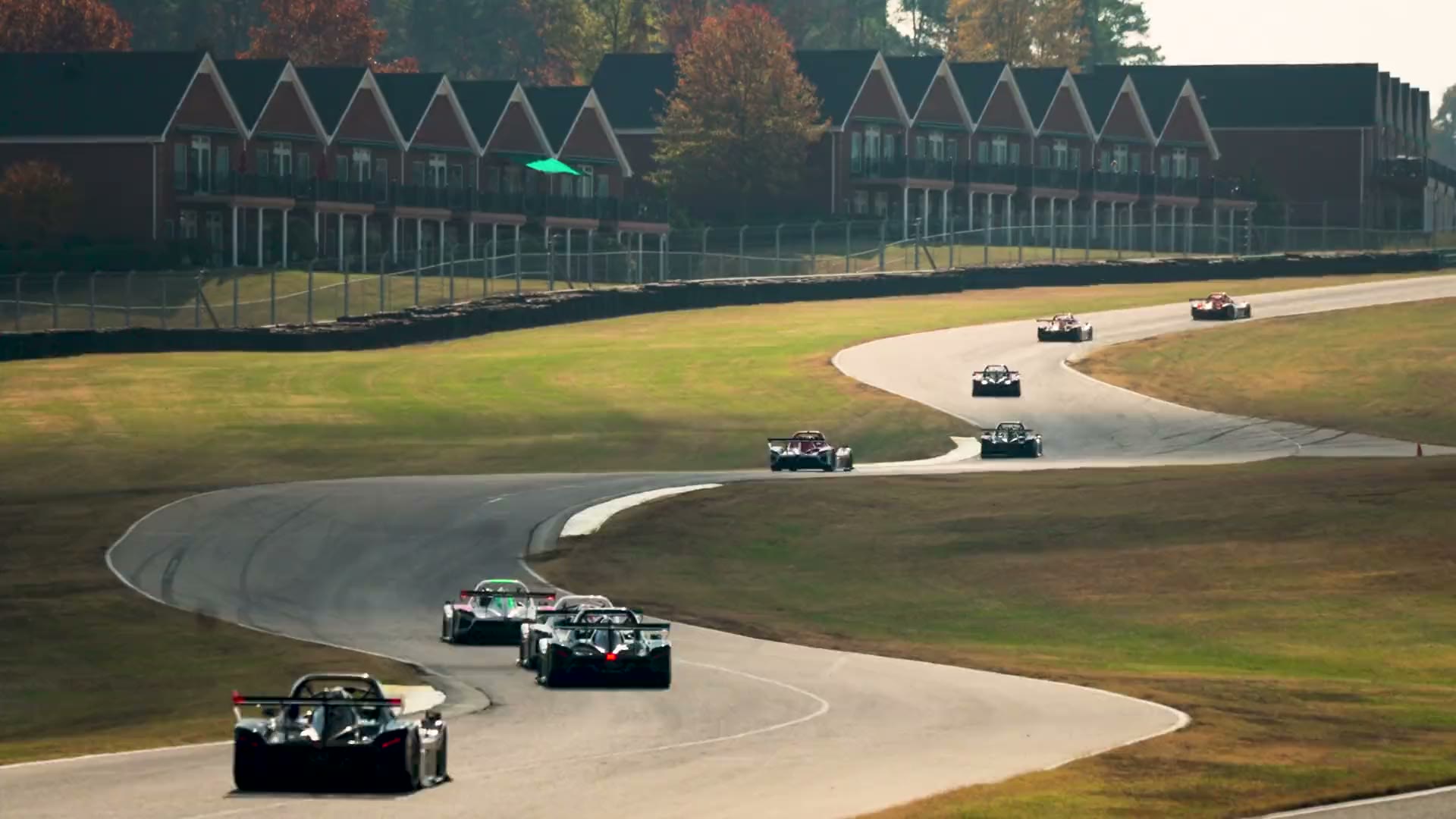 A field of Radical prototypes through the esses at Virginia International Raceway