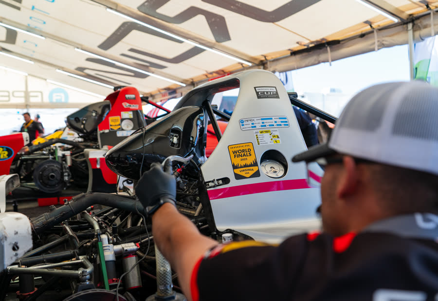 Crown technician working on a Radical Cup car